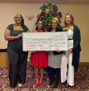 Cinnaire staff presents check to NANBPWC organization