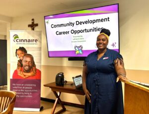 Lafransia Davis in front of PPT presentation